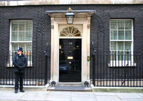 13. This is the address of the head of the British government: a. 221b Baker Street b. 10, Downing S -   